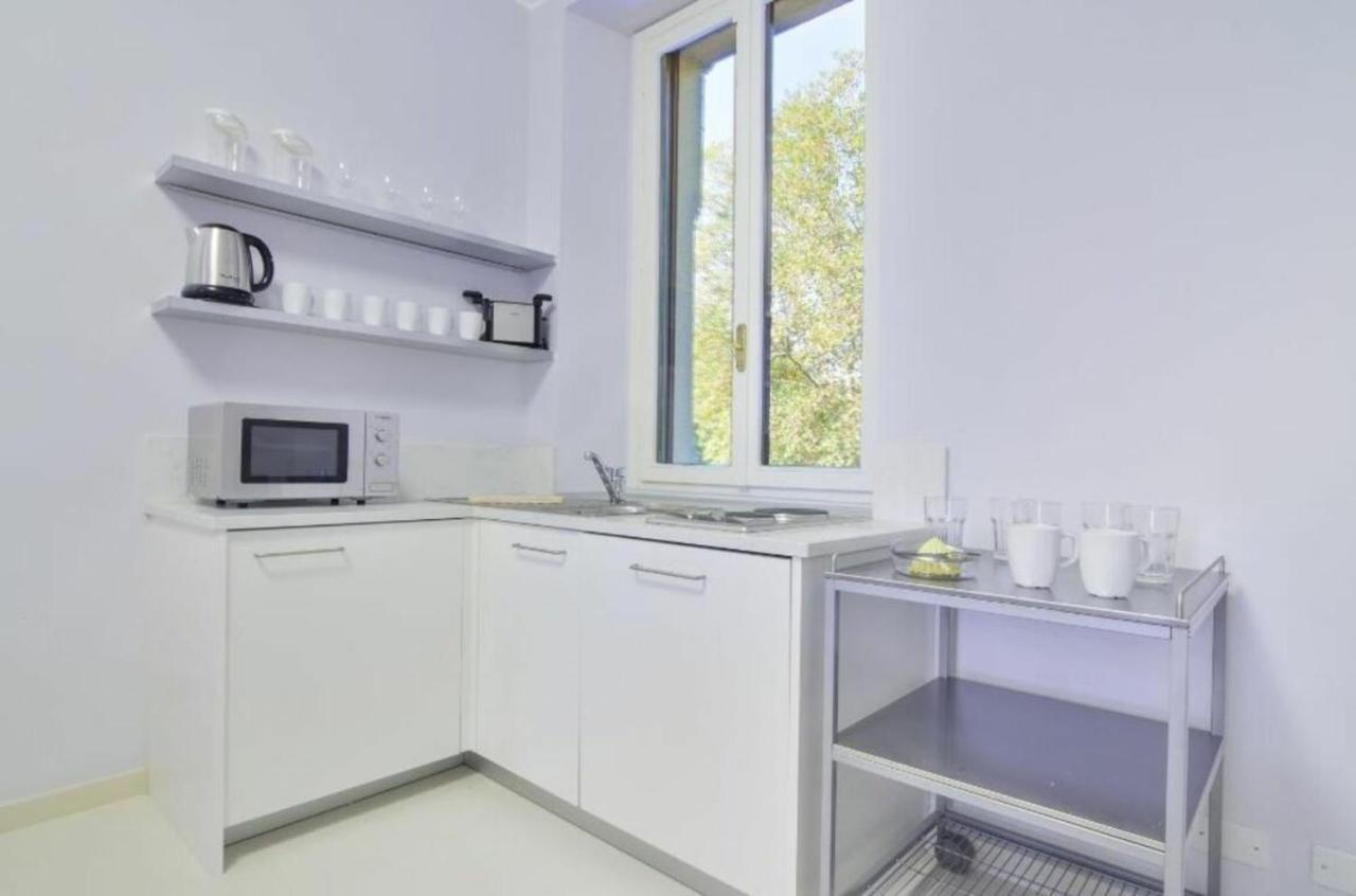 Bacone Liberty Olimpia Apartment Milano Exterior foto